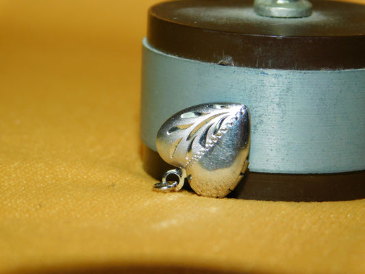 Mini sterling silver heart shaped locket near mint condition