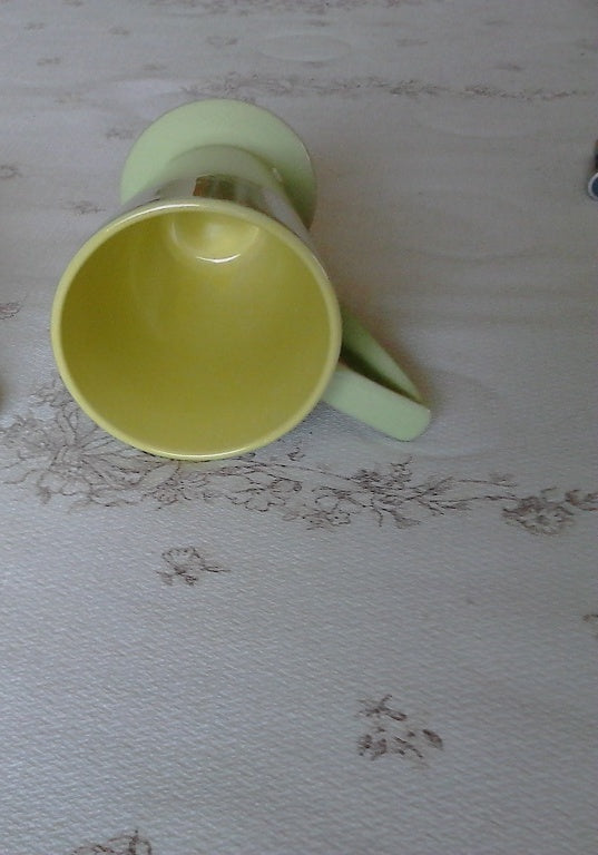 Retro style green and yellow mug near mint condition