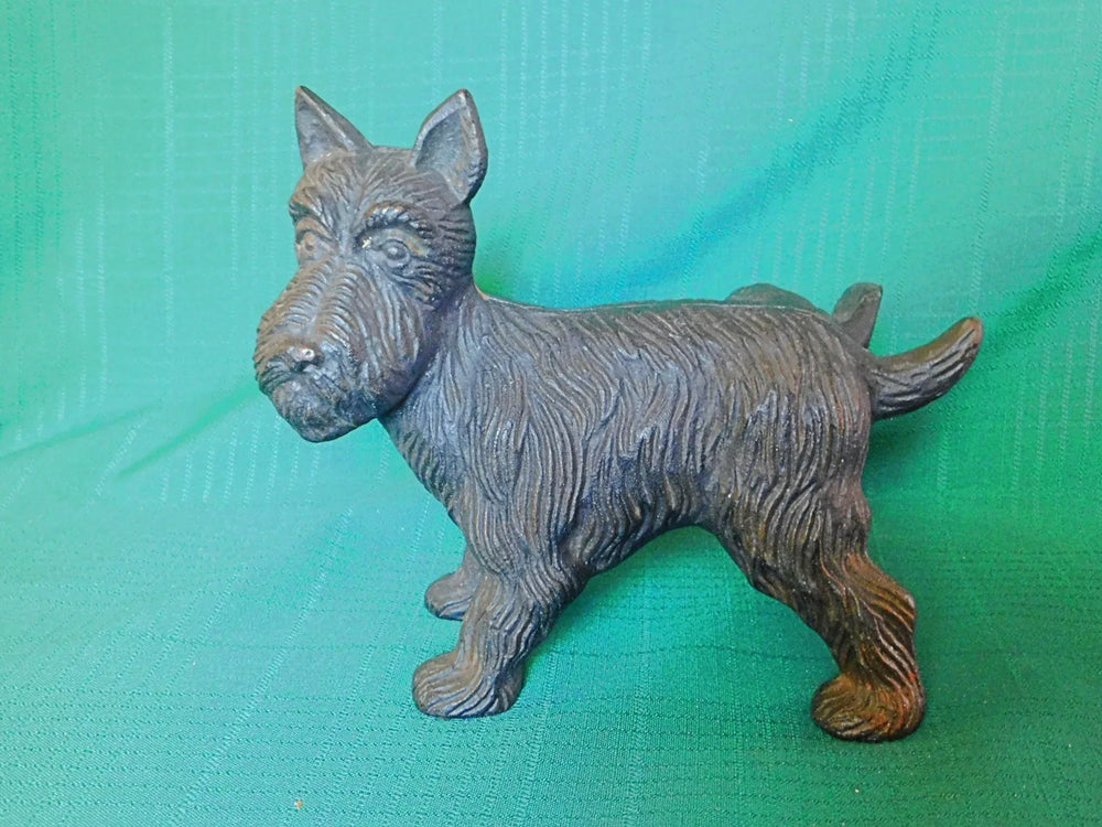 Vintage cast iron Scottish Terrier leg up door stop