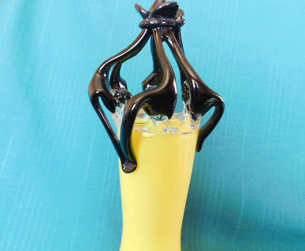 Yellow and black art glass vase near mint condition
