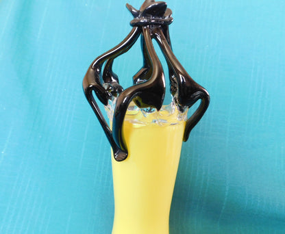 Yellow and black art glass vase near mint condition