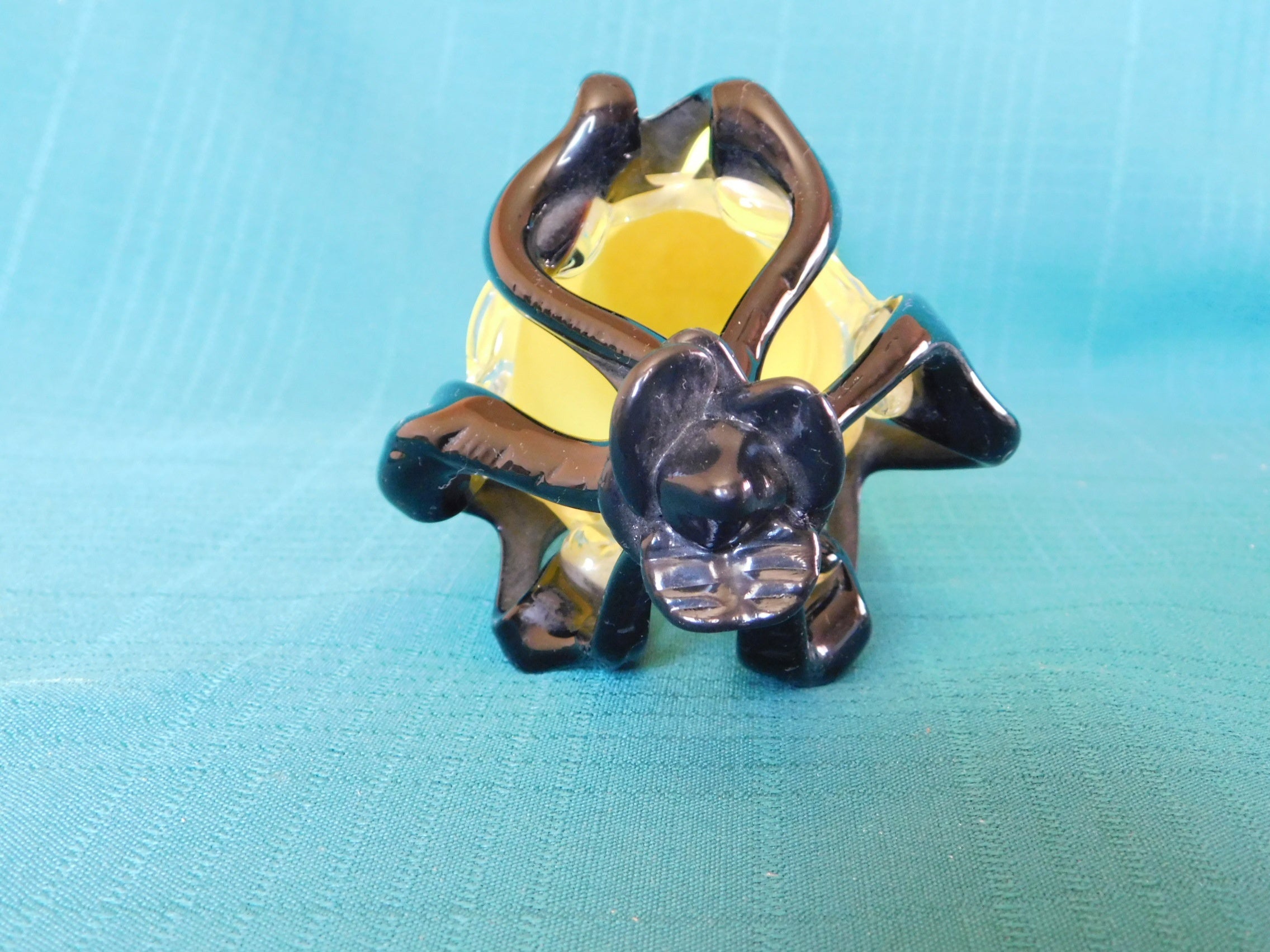 Yellow and black art glass vase near mint condition