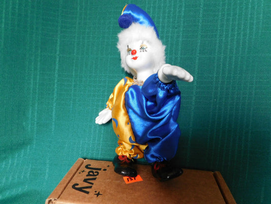 Porcelain blue gold clown doll near mint condition