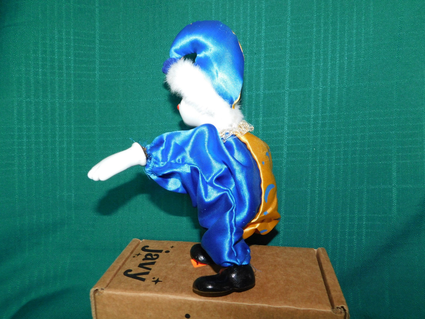 Porcelain blue gold clown doll near mint condition