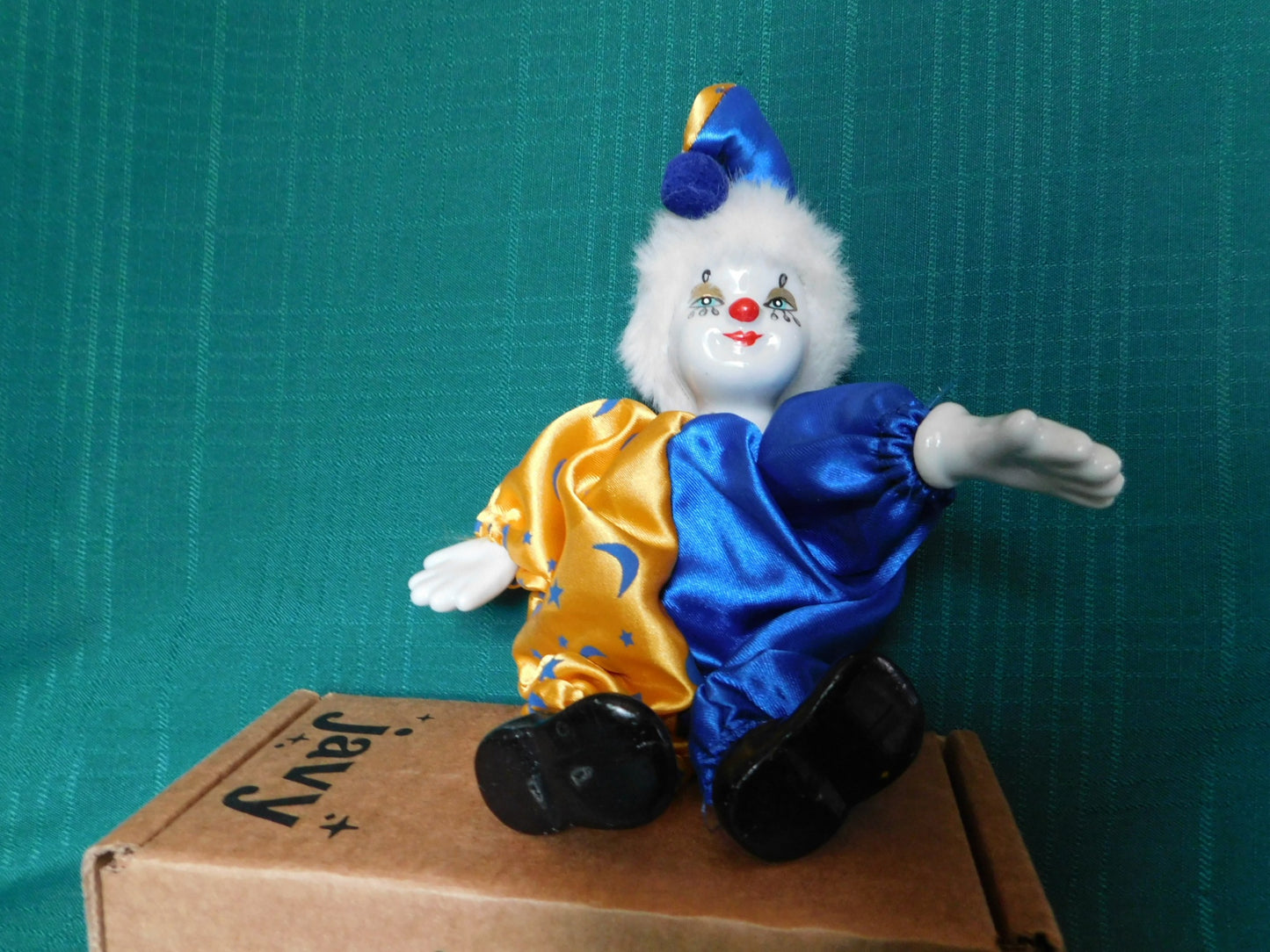 Porcelain blue gold clown doll near mint condition