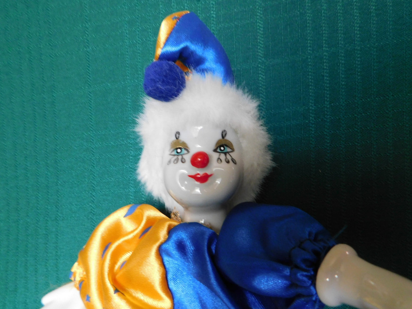 Porcelain blue gold clown doll near mint condition