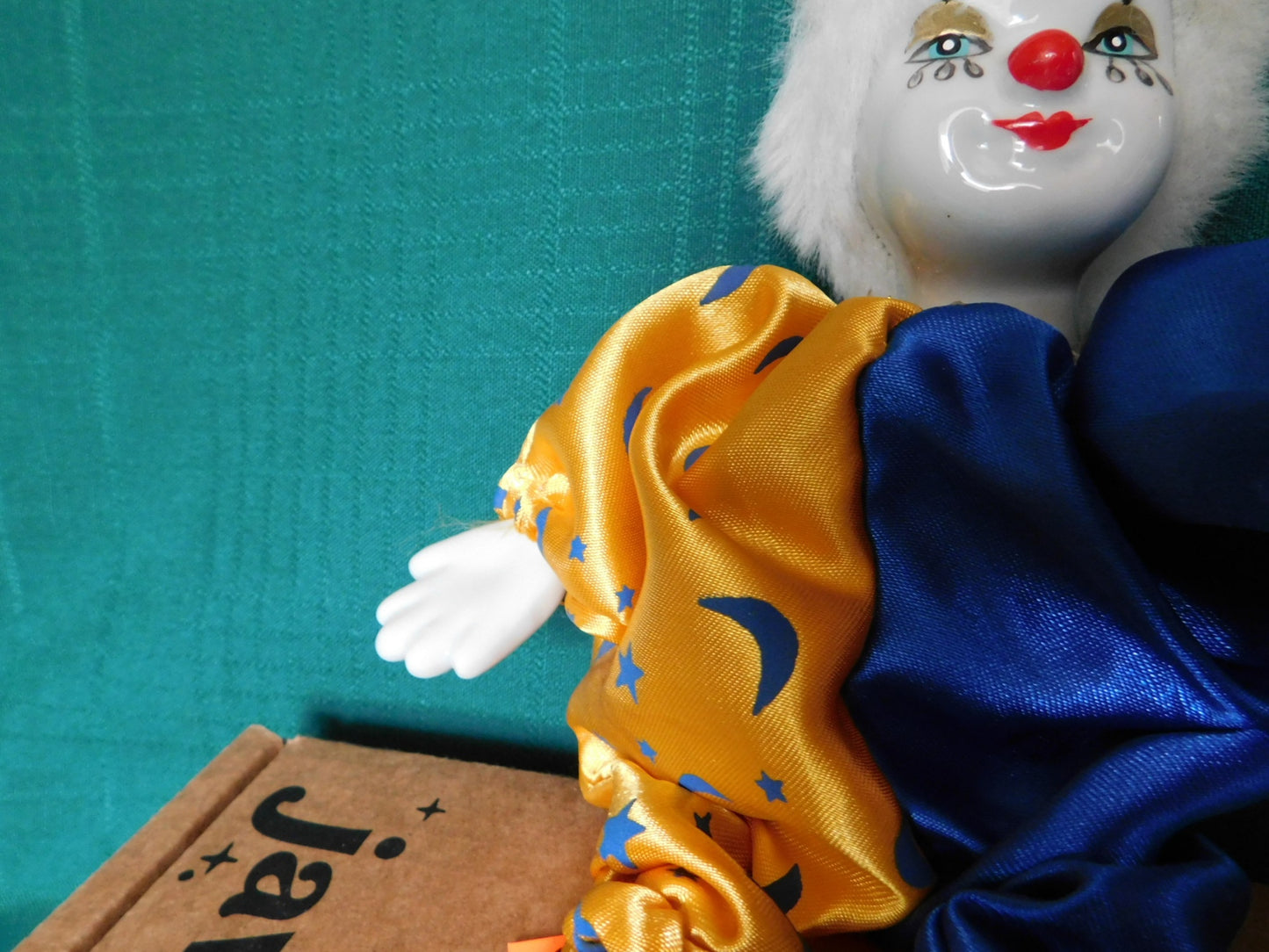 Porcelain blue gold clown doll near mint condition