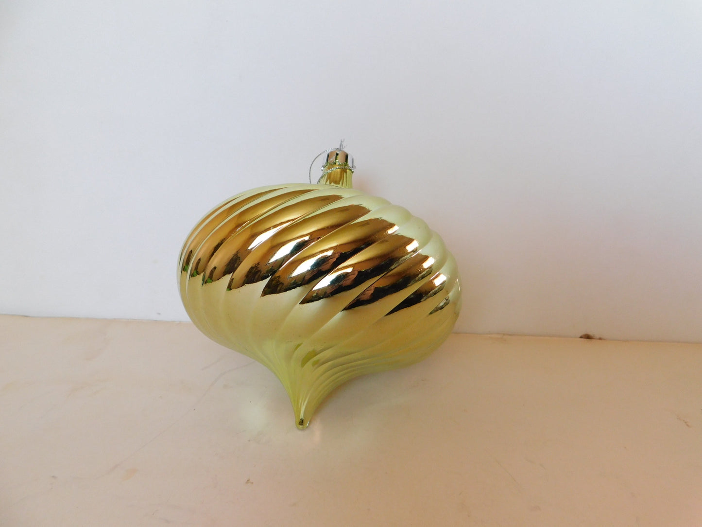 Gold flattened orb shape tree ornament new with tag