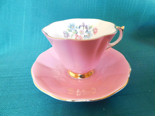 Rare Queen Anne 280 solid pink exterior floral interior cup and saucer