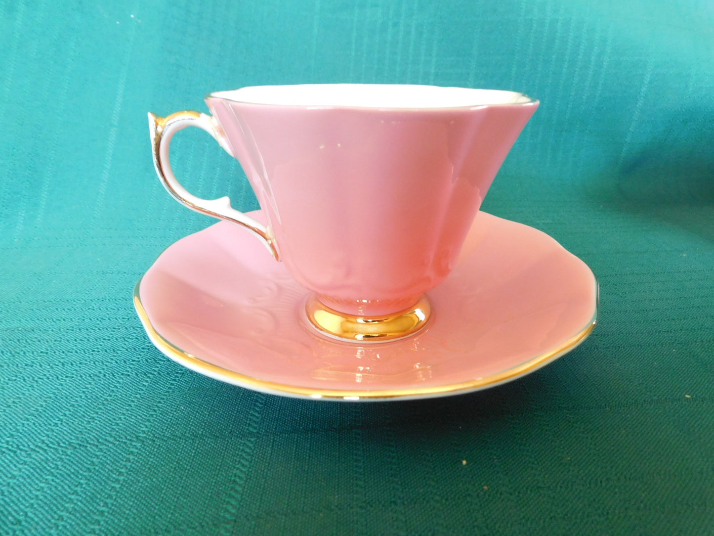 Rare Queen Anne 280 solid pink exterior floral interior cup and saucer