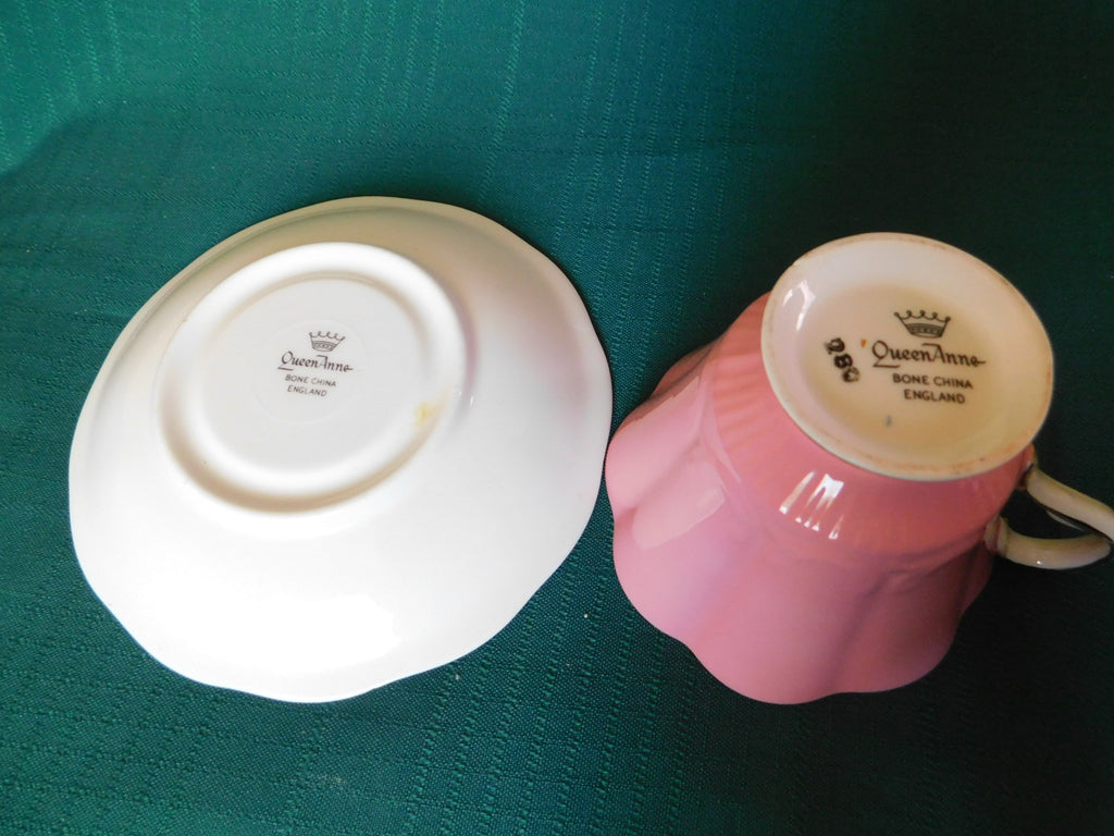 Rare Queen Anne 280 solid pink exterior floral interior cup and saucer