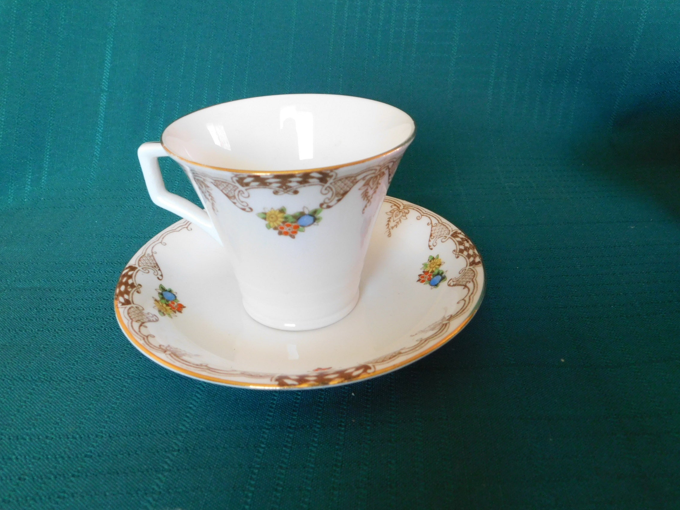 Radfords Joy floral and beige scroll cup and saucer VGU