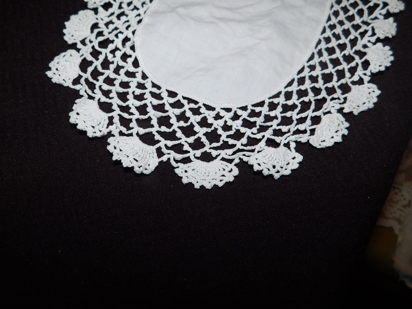 Vintage 13 x 7 oval crocheted doily with linen center