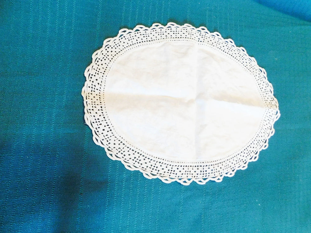 Vintage linen center with floral crocheted edge oval doily