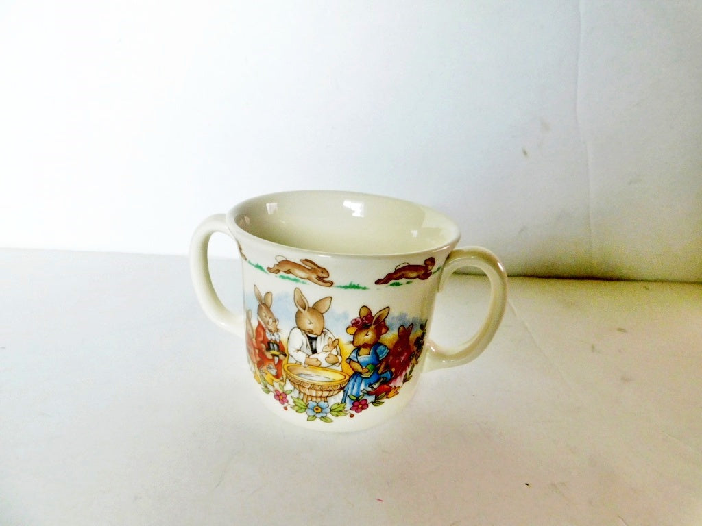 Children's mug with rabbit illustrations on a white background