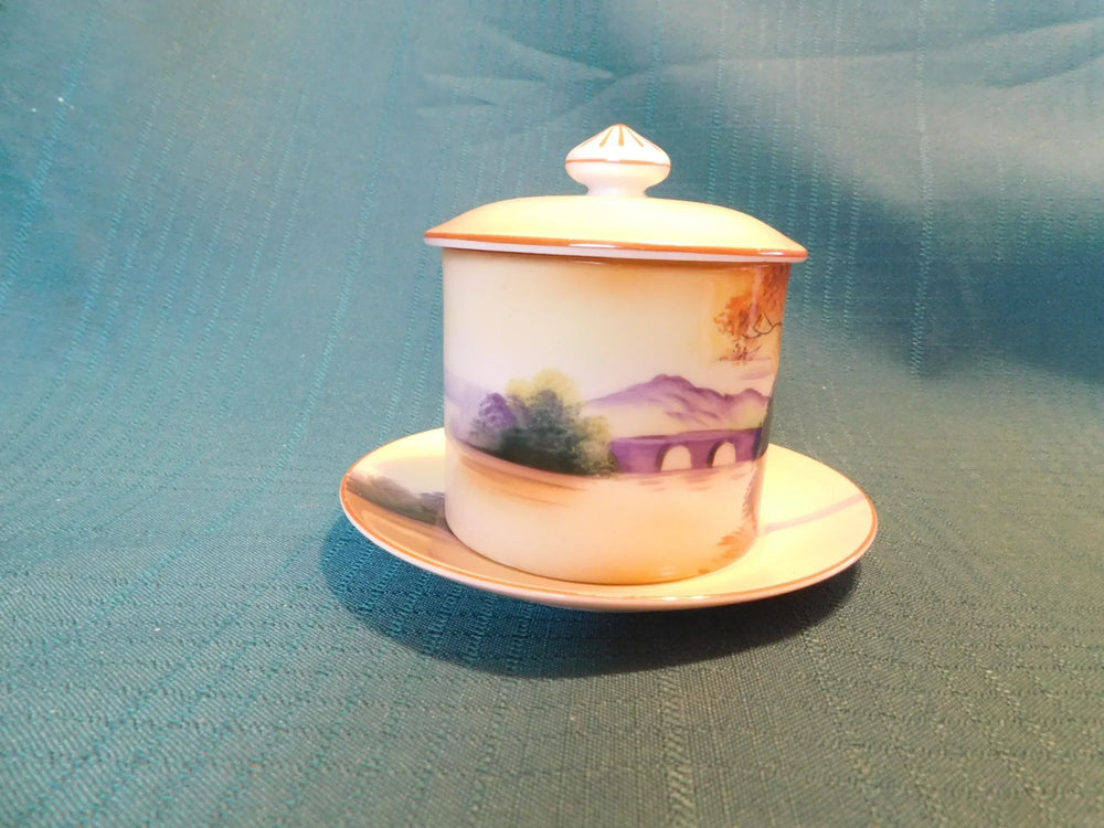 Antique Noritake M (1911) bridge scene lidded condiment jar with underplate