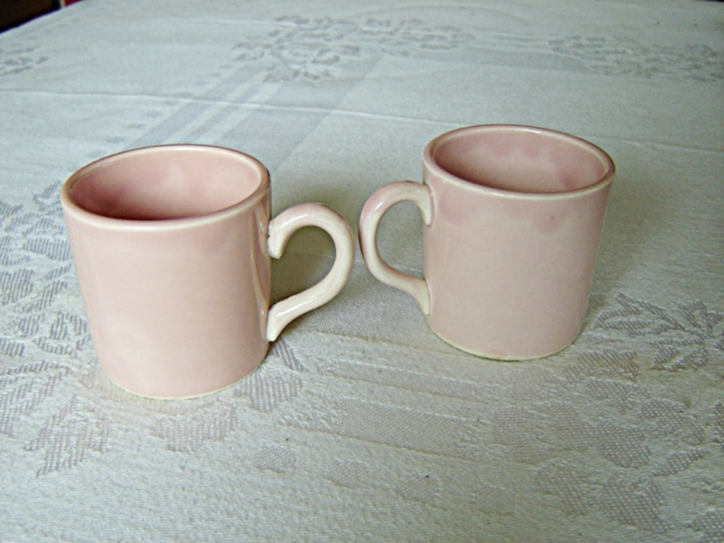 Pair of hand painted pink U.S.A. demitasse mugs near mint condition