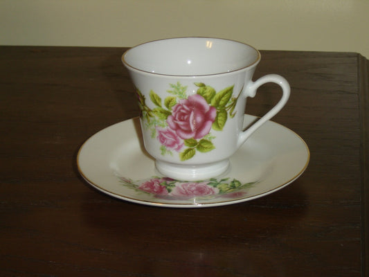 Porcelain pink red Rose cup and saucer mint condition