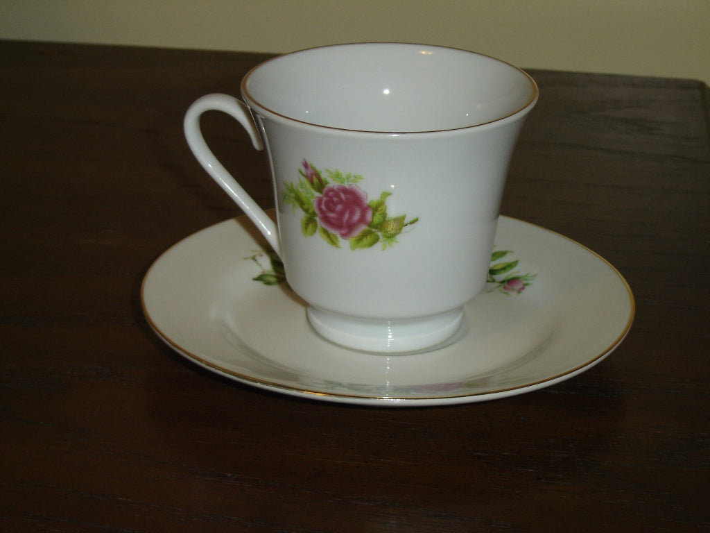 Porcelain pink red Rose cup and saucer mint condition