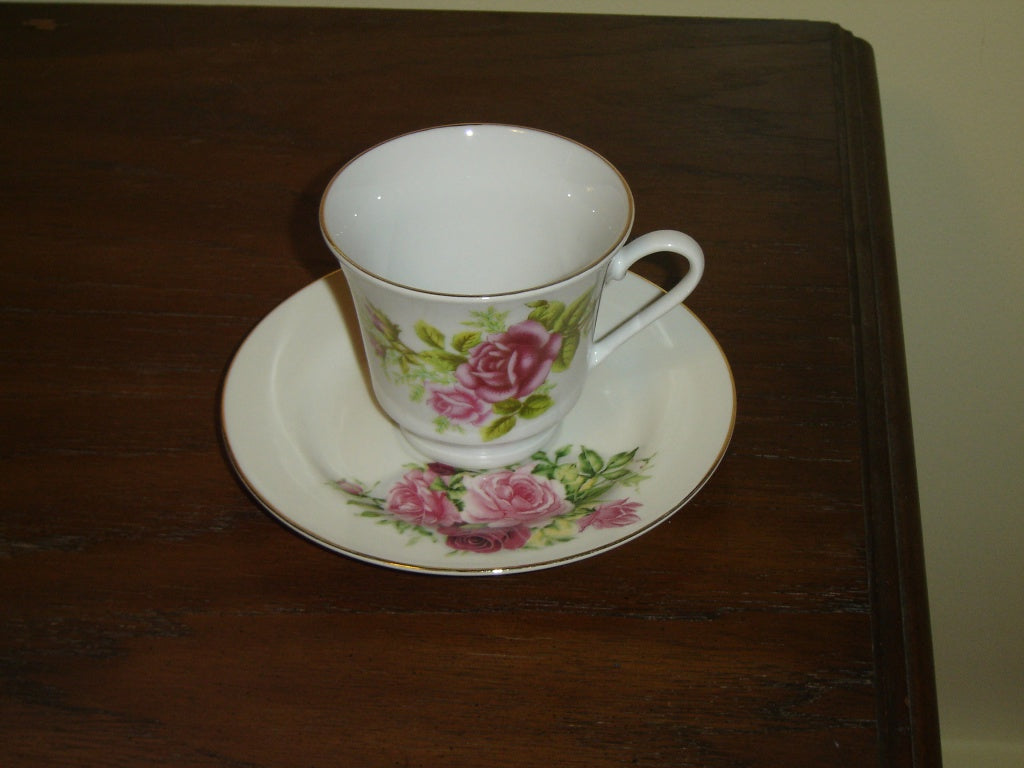 Porcelain pink red Rose cup and saucer mint condition