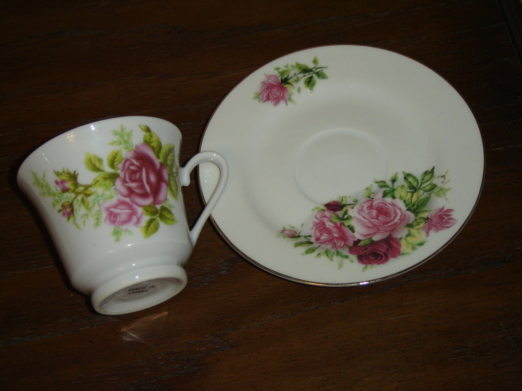 Porcelain pink red Rose cup and saucer mint condition