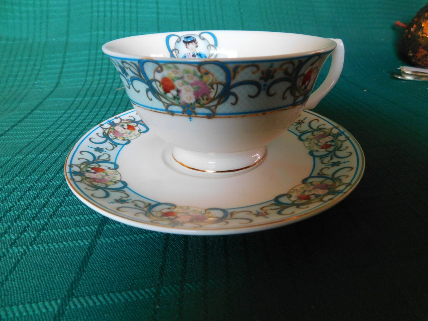 Avon Canada 2009-2010 blue girl floral cameo cup and saucer near mint condition