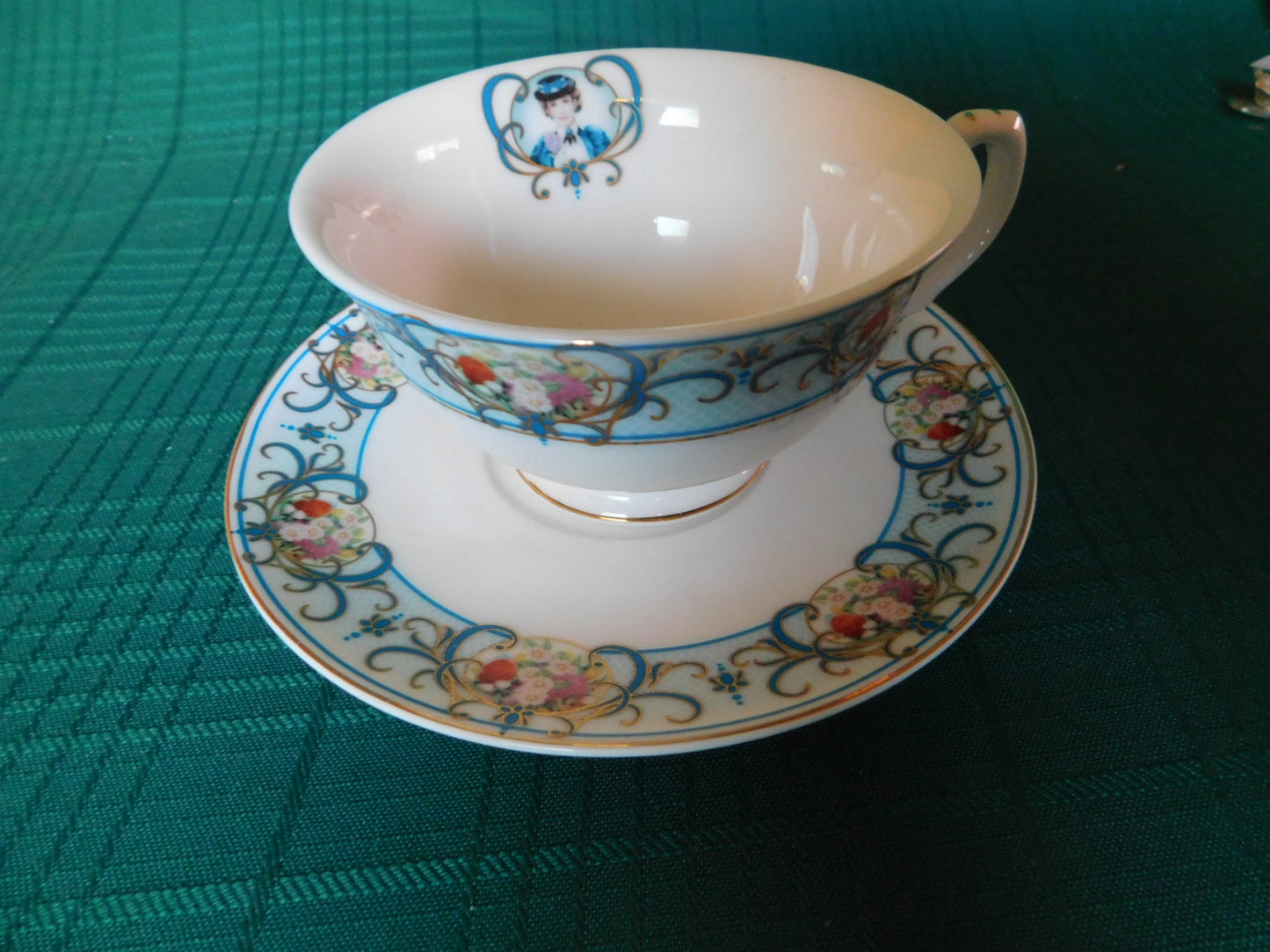 Avon Canada 2009-2010 blue girl floral cameo cup and saucer near mint condition