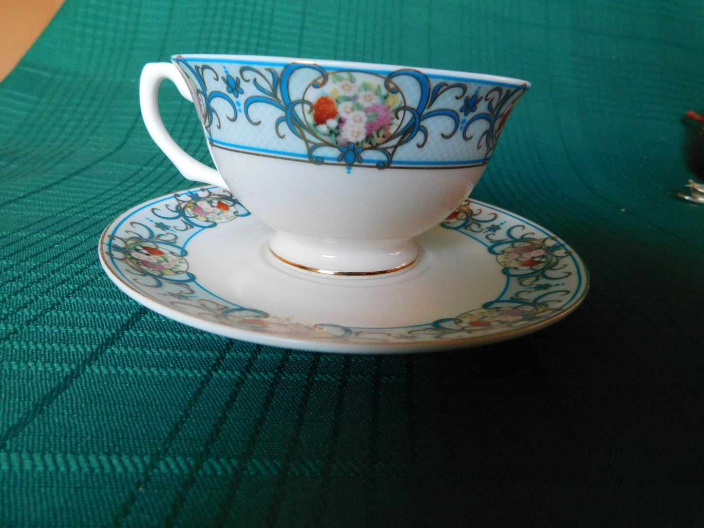 Avon Canada 2009-2010 blue girl floral cameo cup and saucer near mint condition