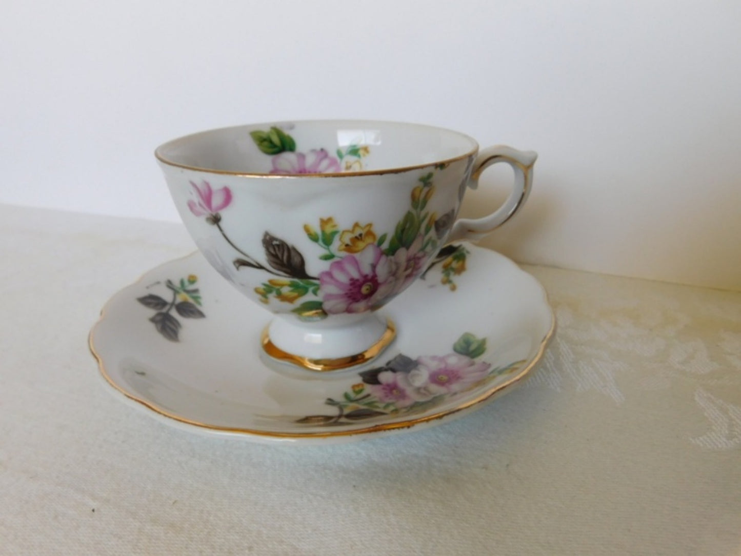 Trimont Japan pink yellow flower cup and saucer VGU