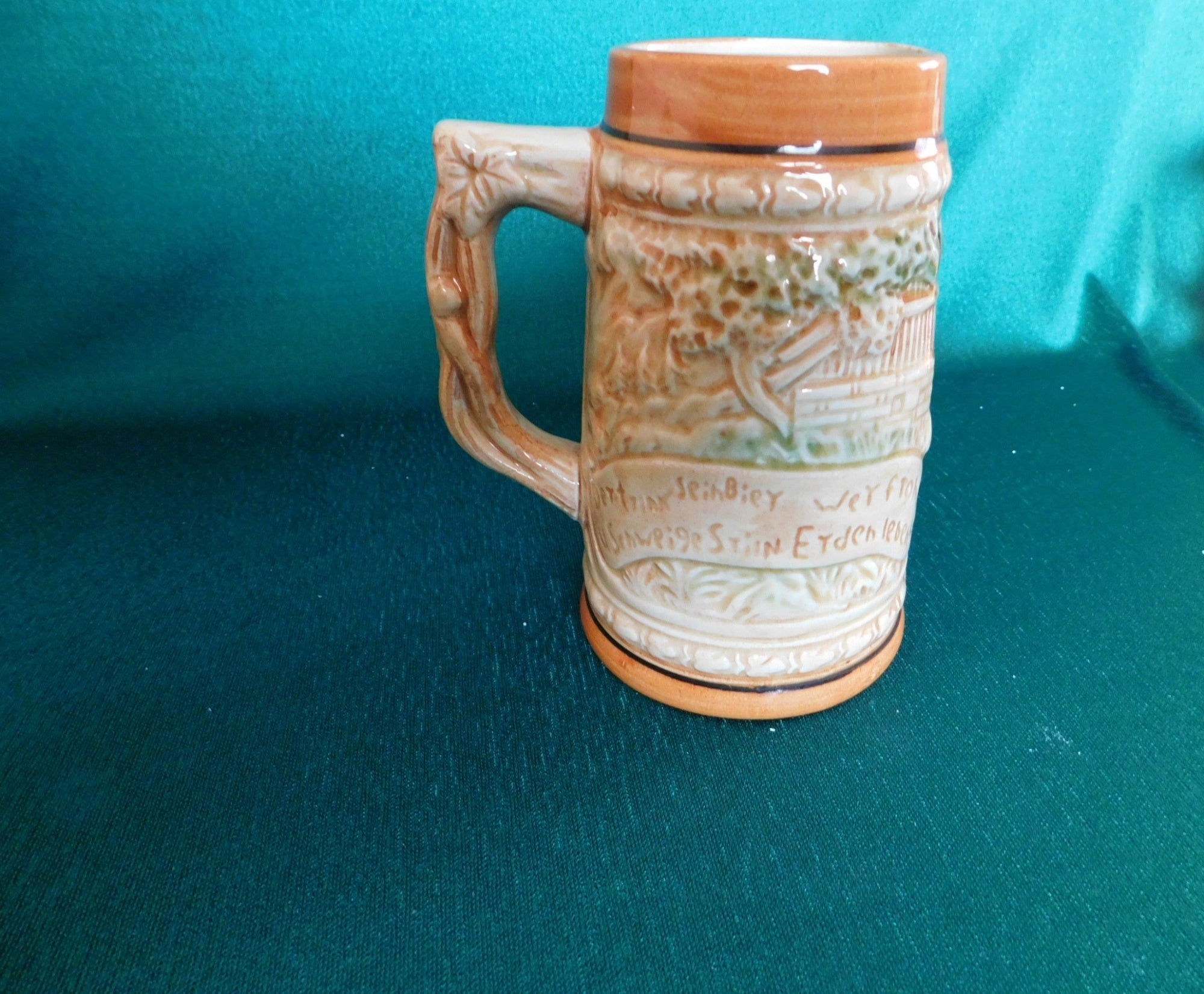 Ceramic beer stein three men