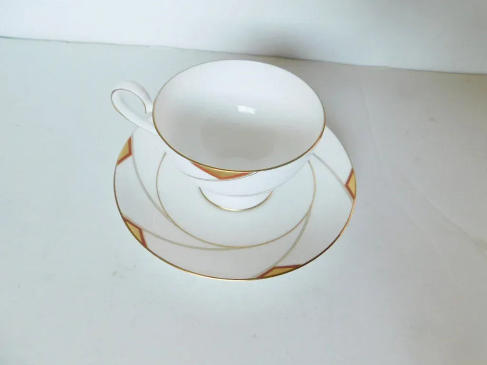 Nikko Rendezvous (1986) rust gold cup and saucer near mint condition