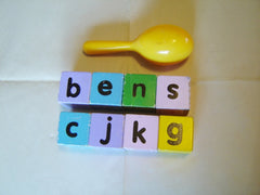 9 piece set of wooden baby blocks and rattle