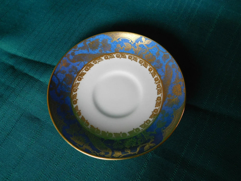 Paragon gold peacock on blue band saucer